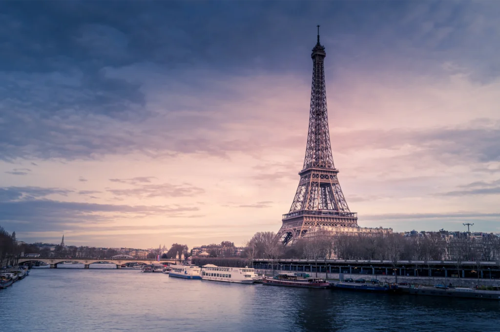 Eiffel Tower in Paris under a colorful sky